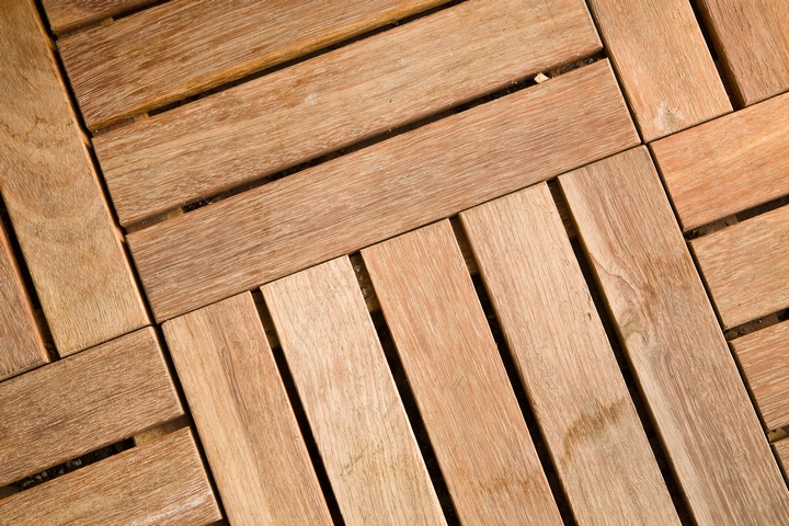 Recycled plastic flooring tiles are good options for condo balcony design.