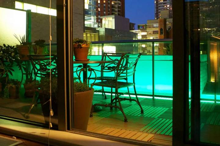 You can experiment with lighting to create cozy balcony ideas.