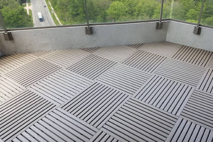 Turn your balcony into office by adding flooring tiles.