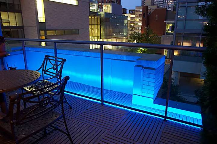 An outdoor balcony home office needs lighting.