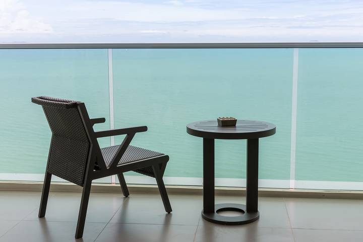 Add minimalist balcony furniture to your condo design ideas.