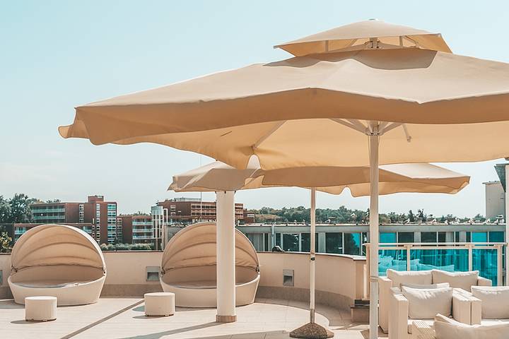 Add an umbrella for your condo balcony party ideas.
